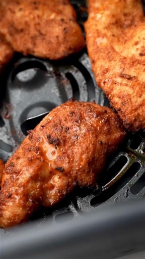 Air Fryer Chicken! Thinly sliced chicken breast pieces, coated to the max in spices, plus a bit of brown sugar and cornstarch, and air fried to golden, juicy perfection. https://pyum.co/3SbL8zK | Pinch of Yum