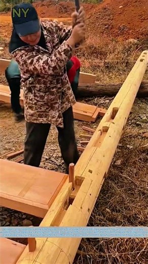 Building a Wooden House Frame Together: Precise Mortise Pegs for the Main Post.