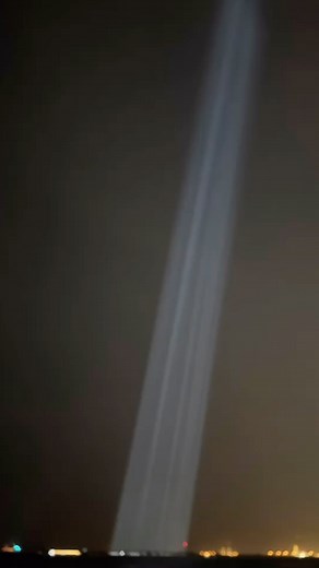 Interactive light art installation by Mexican-Canadian artist Rafael Lozano-Hemmer entitled “Collider” an artwork formed by hundreds of pencil-beam robotic lights that create a glimmering curtain of light, visible from Lulu Island and downtown Abu Dhabi. The lights react in real-time to invisible cosmic radiation that arrives from outer space, originating from stars and black holes. So-called “cosmic rays” are harmful proton and alpha particles that, fortunately, collide with our atmosphere to c