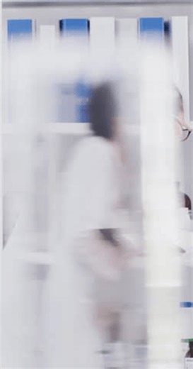 clip-4014247989-pharmacist-woman-reading-bottle-lab-clipboard-review