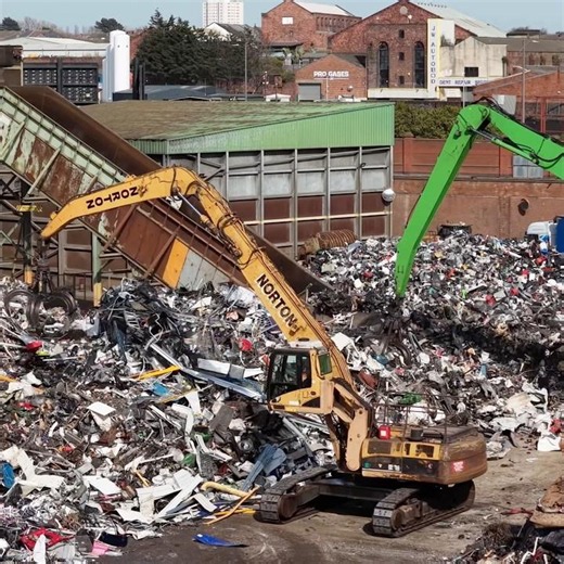 Sennebogen & CAT material handlers feeding the shredder and hammer mill with scrap metal