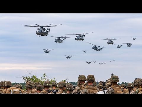 U.S. Marine Corps CH-53E Super Stallions and MV-22B Ospreys participate in a large scale air assault