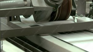 Printed sheets coming out of commercial printing press