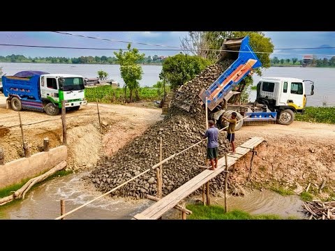 Start Opening New Project!! Dozer BD2A pushing Soil into Flooded area in front of house& 5T​ Trucks.