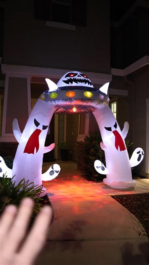 I am absolutely obsessed with how my front yard looks for Halloween this year, and it's all thanks to this one decoration. I wanted to create a full scene, and this giant inflatable alien abduction arch was the perfect centerpiece! ​The level of detail is fantastic. You have this massive UFO with a spooky alien pilot inside whose eyes glow a menacing red. The ship itself is lit up with vibrant, flashing LED lights that make it look like it just landed. It's easily the first thing you notice from