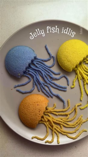 Rohini Deepthi Natti | The Idli Mama on Instagram: "Would you try Idli Noodles? He was so excited while making these idli jelly fish 🪼😄 Natural & safe color idli batter 👇 🧡 Beetroot Powder @kohfoods.in | Code:ROHINI15 💙 Butterfly pea flowers extract. Boil 20 flowers in half cup water and let it reduce to 2-4 spoons. Mix in idli batter. 💛 Turmeric powder in idli batter I used a crinkle cutter for zig zag cut. Turned out way nicer than I had imagined 😍 And now you know what’s coming next 🧜