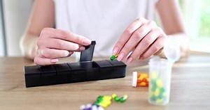 Manual sorting of tablets in boxes for daily use