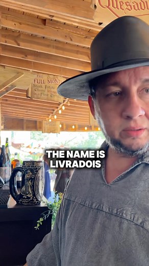 #raclette is a new food item at the #texasrenaissancefestival a French wheel of cheese is melted and scraped onto a baguette with salami or ham, little Cornish pickles, green onions and Dijon mustard. This dish from the Swiss Alps is a cheese-lover’s dream and a new offering at Sir Loin of Beef booth 155 Huzzah! | Texas Renaissance Festival