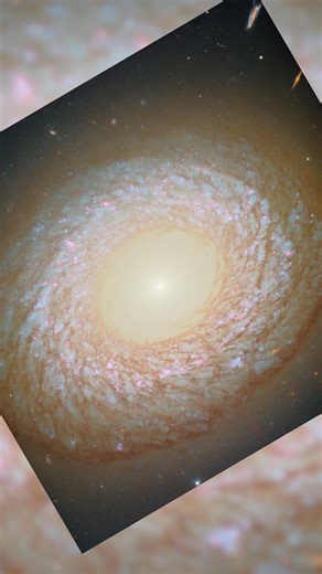 A galaxy far, far away… 67 million light-years, to be exact. NGC 2775 sports a smooth, featureless center that is devoid of gas, resembling an elliptical galaxy. But it also has a dusty ring with patchy star clusters, like a spiral galaxy. So which is it: spiral or elliptical — or neither? Because we can only view NGC 2775 from one angle, it’s difficult to say for sure, though most astronomers classify it as a flocculent spiral galaxy. Flocculent spirals have poorly defined, discontinuous arms t