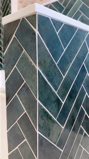 Herringbone pattern finished with clean miter cuts. #diy #bathroomdesign #installation #herringbone