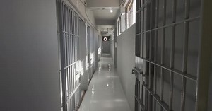 Hallway full of empty Prison jail cells