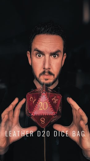Leather • Misfit • Magic • Maker on Instagram: "This veg-tan leather D20 dice bag is basically a portable side quest. Hand dyed, hand stitched, and the numbers are carved in like little runes, then brushed with antique gold. Legend says it was last seen at a tavern table right before someone said, “I roll to seduce the dragon,” and the DM did that long, silent stare. 😅 Keep your dice in here and they’ll behave… probably. No promises. #leatherdicebag #handmadeleather #leathercraft #dndgear #tabl