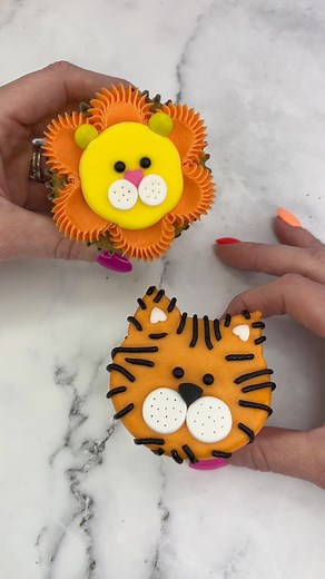 2.3M views · 29K reactions | Easy tiger 李The second animal in our ZOO 女 Which animal should we add next? 拾李I shaped my cupcakes using marbles. I added orange buttercream for the face and pressed it onto parchment paper. I popped him in the freezer for 15 minutes to allow the buttercream to firm. I then added sprinkles and black buttercream stripes. #cupcake #cupcakedecorating #animalcupcakes #cakedbyrach #tutorial #tigercupcakes | Caked By Rach | Facebook