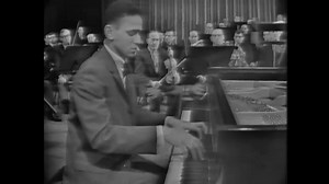 André Watts was a pianist whose powerful virtuoso technique and magnetic personality captivated international audiences for more than six decades, making him one of the first Black superstars in classical music. At only 14, Watts made his debut with the Philadelphia Orchestra. Two years later, he won an opportunity to perform Liszt’s Piano Concerto No. 1 in a televised Leonard Bernstein New York Philharmonic “Young People’s Concert” devoted to young performers. When introducing the pianist, Bern