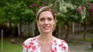 Beautiful 30s woman portrait. Pretty american girl look at camera. White teeth smile close up. Cute joy blond person head shot. One nice lady walking at park. Happy female face. Young adult 20s model.