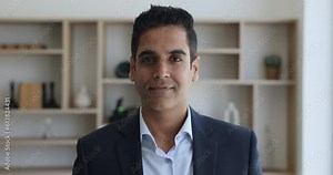 Head shot portrait of middle-aged businessman, leader, company owner. Confident mature 50s businessman, CEO or executive manager in suit look at camera pose at workplace smile relish business success