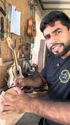 Simple maintenance on the cavaquinho (a small Brazilian stringed instrument).