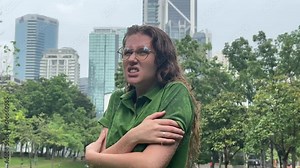 Sad woman under summer rain.emotional girl wet in the rain without umbrella.woman walk in the rain.young attractive woman is wet in the rain