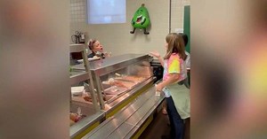 Students learn how to sign to cafeteria worker, who is hard of hearing