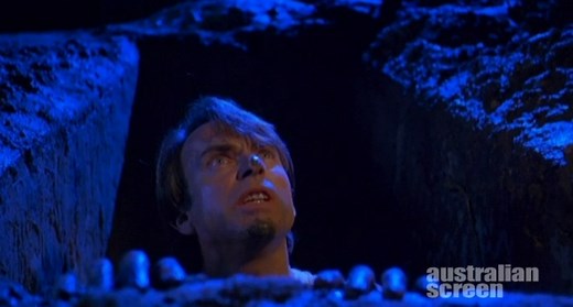 Death in Brunswick (1990) tells the story of an under-achieving Aussie cook who falls for a young Greek waitress at a seedy Melbourne nightclub... but a dead body gets in their way. The extremely popular comedy starring Sam Neill, Zoe Carides and Nicholas Papademetriou went from being potentially charming to explosively funny with the casting of John Clarke as Dave the gravedigger. See more clips from the film in the Australian Screen Collection. https://aso.gov.au/titles/features/death-in-bruns