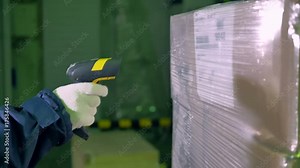 Bar Code Scanner. Worker use bar code scanner for checking goods at a warehouse. 4K.