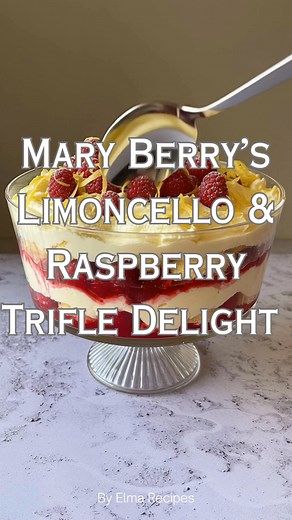 Mary Berry’s Limoncello & Raspberry Trifle Delight 🍓🍋 A refreshing and indulgent dessert that layers tangy lemon curd, luscious mascarpone, and vibrant raspberries, all enhanced by the zesty kick of limoncello. Ingredients: - 300g fresh raspberries - 6 trifle sponges - 4 tablespoons lemon curd - 10 tablespoons limoncello - 250g full-fat mascarpone cheese - 300ml vanilla custard (store-bought or homemade) - Zest of half a large lemon Directions: Prepare the Sponges: In a shallow dish, combine t