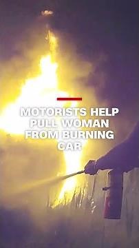 Passing motorists help pull woman from burning car