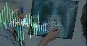 Examining X-ray, doctor analyzing data with animated overlay in medical office