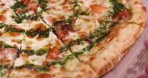 take pizza with red trout fish and green sauce, delicious pizza with fish food and seafood