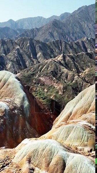 Aerial drone view of the colorful layered rock formations of Zhangye Danxia National Geopark in Gansu Province. Vertical Stock Video Footage - Alamy