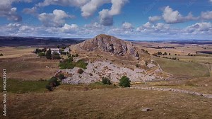 Drone Circular Tracking Shot Around Pic de Marchastel in Aubrac – Daytime Aerial View