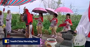 In Taiwan, short skirts and professional mourners at funerals is a custom slowly being laid to rest