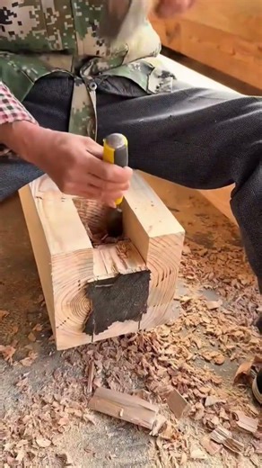 making a square hole on the wooden block precisely using a sharp metal chisel #shorts