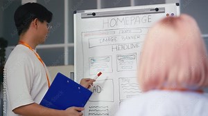 Asian man IT school tutor reading web design course near whiteboard to students