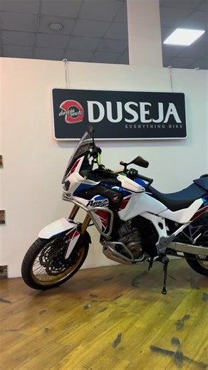 DusejaMoto #1UAE on Instagram: "The name ‘Africa Twin’ carries a legacy on its shoulders. This is the motorcycle you get when a 3-time Paris-Dakar winning, factory bike undergoes evolution during 4 decades. . This 2023 model is a perfect example! An adventure bike, so very nimble & versatile yet, it makes no compromises on comfort or capability. . 1084cc, liquid-cooled, OHC 8v, parallel twin, 101hp@7500rpm, 105Nm@6250rpm, 6 speed DCT, EFI Showa suspension (F&R). Add to that the sweet DCT gearbox
