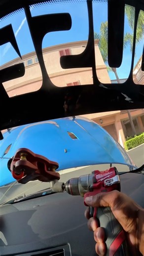 BMW removing windshield with string tool