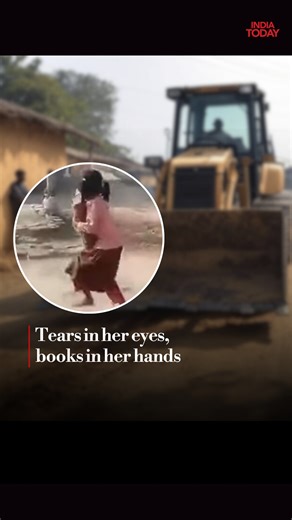 A heartbreaking scene has emerged from Ambedkar Nagar, Uttar Pradesh, where a young girl was seen running from her hut with her books during a bulldozer action. #ambedkarnagar #uttarpradesh #books #buldozer #girl | India Today