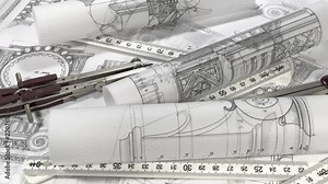 workplace of the architect: rolls of architectural drawings - blueprints, yardstick - folding ruler, a pencil and compass smoothly rotate on the surface of the architectural plan of a modern house