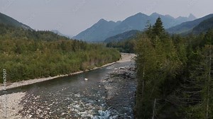 Aerial view (left track) of Chilliwack River during a summer season in Chilliwack, British Columbia, Canada