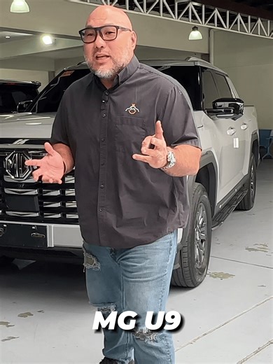 King Panda Reveals the MG U9 – Smart Features You Should See 🔥 From the massive grille and sleek LED headlamps to the wireless charger and dual‑screen setup, the MG U9 delivers luxury where other pickups don’t. Leather interior, flat‑bottom steering wheel, and premium buttons make it feel next‑level. Storage? Huge compartments and cup holders everywhere. Watch the full review and see if the MG U9 is the perfect fit for you! #MGU9 #MGPhilippines #MGU9Philippines #PickupTruck #TruckReview #Midsiz