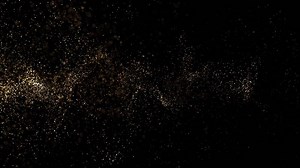 Animation of abstract golden glowing glitter particles. Flying bright dots and dust particles on a dark background