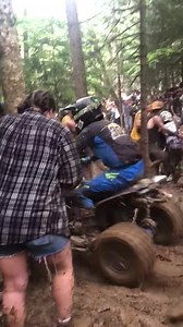 “Mud Fleas” - race maniacs - help ATV riders get through Howard’s Hole at the GNCC race at Snowshoe. | The Exponent Telegram