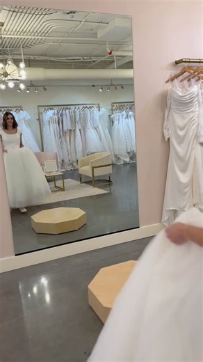 ✨ Minimal chic wedding dress, but make it modest✨ Meet @allurebridals M770 gown 😍 A modest ballgown made for brides who love romance without the fuss. From the soft scoop neckline and cap sleeves to the Mikado bodice and subtle Basque waist, every detail whispers timeless beauty. The voluminous tulle skirt and detachable bow add a touch of regal drama that’s finished with a trail of luxurious fabric covered buttons all the way down the back and train. Ready to try her on? ALL of our modest gown