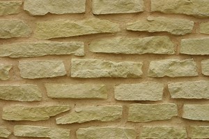 How to Face a Concrete Block Wall With Stone