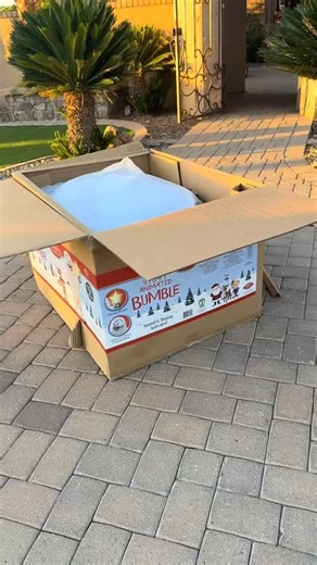 The neighbors put up a wreath. We’re just getting started over here with a 9.5 foot abominable snowman. ☃️ | Travis A. Flaherty