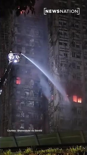 Hong Kong firefighters battle burning towers for a second day