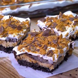 Butterfinger Lush makes one of the most delicious potluck desserts ever! Full Recipe: http://spicysouthernkitchen.com/butterfinger-chocolate-and-peanut-butter-lush/ | Spicy Southern Kitchen