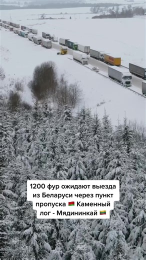 Trucks Lined Up on a Snowy Road