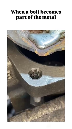 all world 🌎🌍🌍 on Instagram: "The post showcases a DIY welding hack for repairing stripped threads by drilling and tapping an oversized hole in rusty metal, inserting a bolt, applying flux, welding the head flush, and grinding smooth to create a permanent stud, amassing 4 million views in under two days. Community feedback highlights technique flaws like hand-drilling wobble causing loose fits, with critics recommending Heli-Coil inserts for reusable threads, while supporters praise it for sup