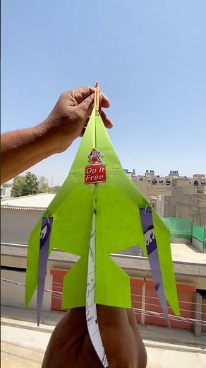 Air-controlled fighter jet paper airplane takes to the sky in a dynamic flight.